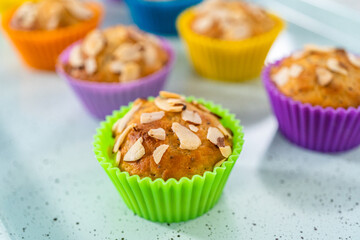 Lemon poppy seed muffins garnished with almond slivers