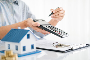 Fototapeta premium Real estate agents bid homes in the project to explain in detail to clients. Explain and present information about home and mortgage purchases. real estate trading ideas