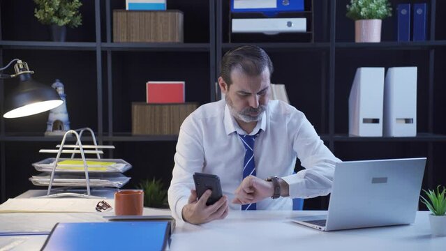 Businessman waiting for phone call, stressed and nervous.