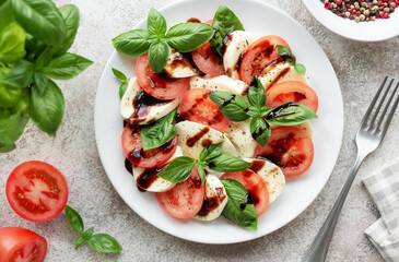 Caprese salad with tomatoes, mozzarella and basil.