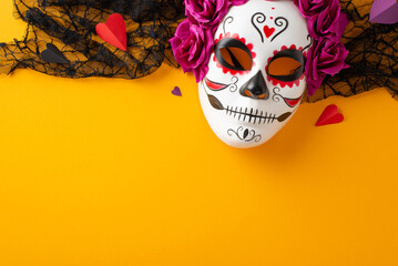 Join the spirit of the Grand Dia de los Muertos festival. Top view composition showcasing a decorated skull mask with vibrant details on a yellow isolated backdrop. Ample space for text