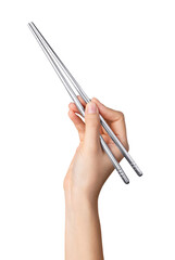 Hand holds iron chopsticks on isolated background.