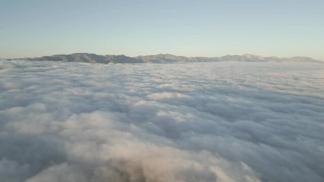 Epic aerial views from Mount Wilson, LA, at 11k feet. Breathtaking landscapes above the clouds. Nature's majesty in motion.
