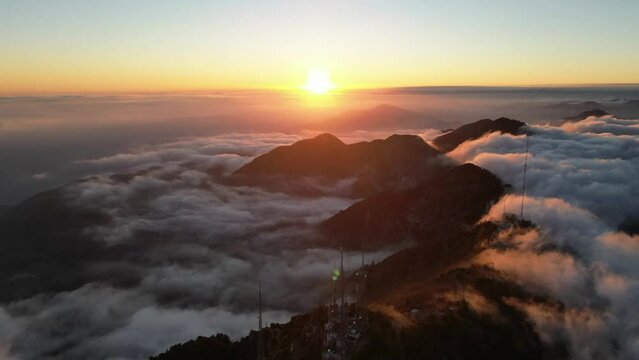 Epic aerial views from Mount Wilson, LA, at 11k feet. Breathtaking landscapes above the clouds. Nature's majesty in motion.
