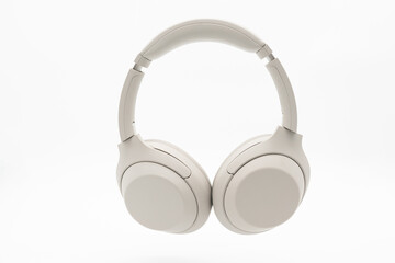 Wireless Silver headphones background on isolated background. With Noise Cancelling and Integrated...
