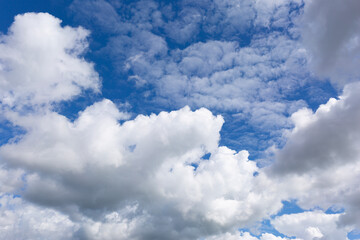 Stratocumulus Clouds on Blue Sky Background.