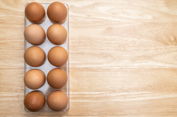 Chicken eggs containing in a tray. Chicken egg is a main component of the human diet serving as a dietary source of protein, fat, and other nutrients.