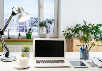 Office workspace with desktop computer, office supplies