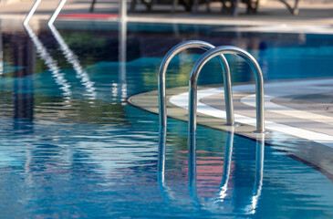 Naklejka premium Metal ladder from the pool