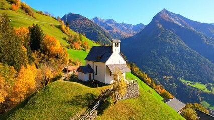 Fototapeta na wymiar white church Sankt Hippolyt - St leonhard im Passeiertal - South Tyrol - drone flight