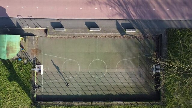 Basketbal field from above with a bike path next to it. Netherlands, Groningen.