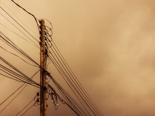 Electricity post with wires and cables. Landscape photo.