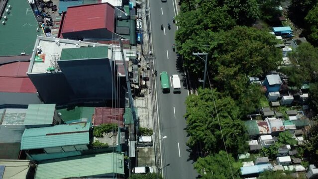 Top Down Drone shot of Cars passing by on streets of Manila, Philippines