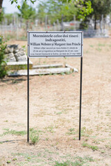 Photo of a sign standing alone in a vast dirt field Danube Delta birds wild life