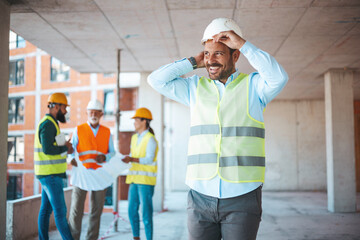 Portrait of man architect at building site. Confident construction manager in formal clothing...