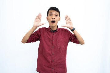 Asian man, businessman or student concept wearing red casual shirt, shouting with hand in mouth, giving information or whispering, isolated on white background.