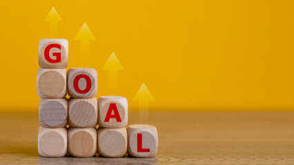 Business goal concept. goal and arrow up a sign on wooden blocks, Business strategy planning...