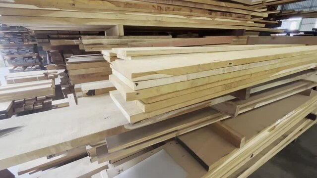 Woods stack in the sawmill.  Pile of woods on shelves in factory