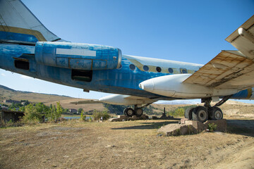 Fototapeta na wymiar View of old abandoned plane in outdoors.