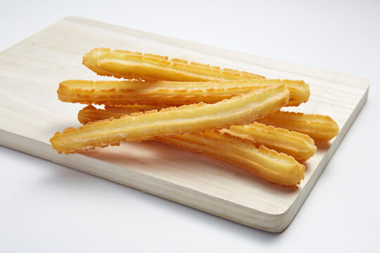 churros on wood serving board