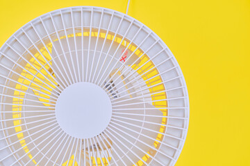 Air circulator on yellow background.