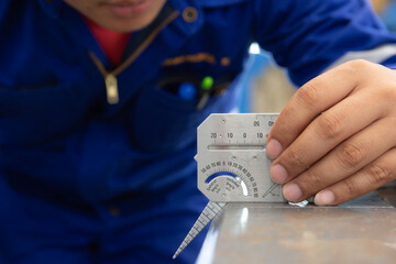 QC inspector measure the bevel angle with Multi Welding Gauge. Welding Gauge is a measuring tool...