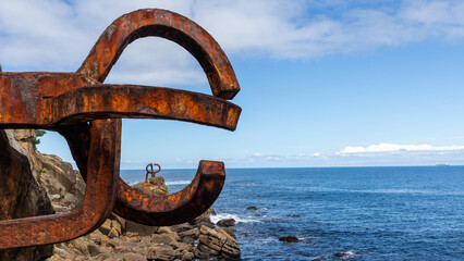 Fototapeta premium Piece of art made of old metal by the sea