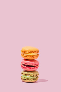 Multi colored macaroons stacked in studio