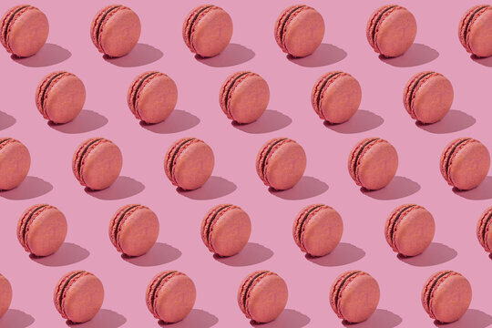 Background of crunchy macaroons on pink background