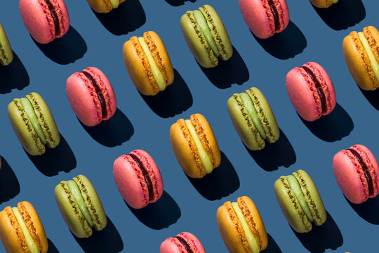 Multi colored macaroons on colored background