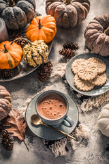 Chai chocolate  or hot cacao with chai cookies, pumpkins for Thanksgiving breakfast.
