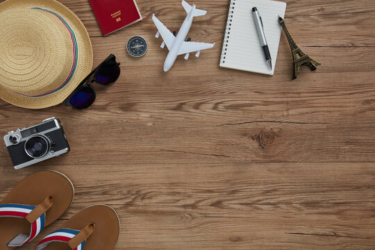 top view of travel gadgets on wooden  background for travel concept