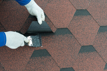 roof repair elimination of leakage smear seams and cracks with a trowel tar