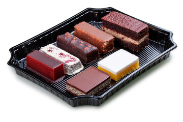 A set of gourmet cakes and desserts packaged for takeaway. Takeaway food. Isolated on a white background.