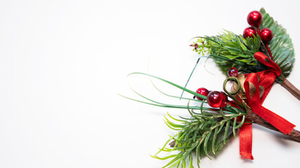 pine ornament with berries on white background