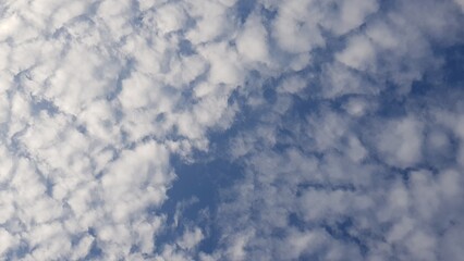 Blue sky on a cloudy morning in spring with beautiful sunshine.
