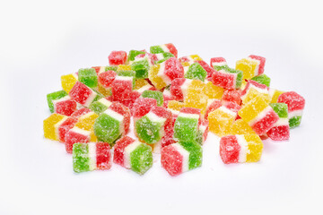 colorful marmalade cubes in sugar on white background