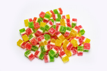 colorful marmalade cubes in sugar on white background