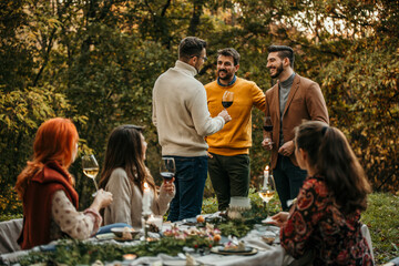 The essence of a memorable garden lunch, where friends come together to create cherished moments in a picturesque outdoor setting.