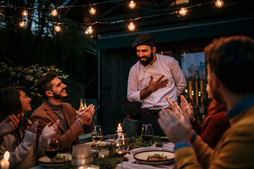 A tranquil scene of a garden lunch, with the chef and their culinary creations taking center stage amidst the natural beauty