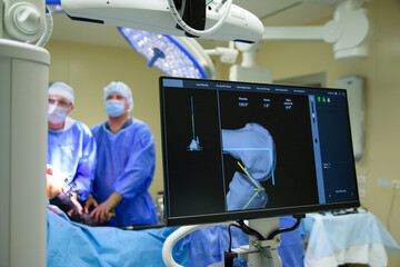 Group of mixed-races professional surgeons and nurses in uniform performing heart transplant...