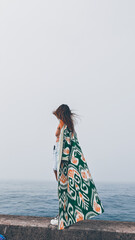 The girl and the fog over the ocean