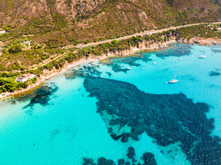 Drone view of a beach with perfect blue water in Sardinia Italy. luxury travel destination