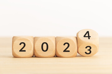Wooden Blocks with changing number from 2023 to 2024. New year concept. Copy space