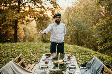 The chef serves food and curates an unforgettable culinary experience for the people.