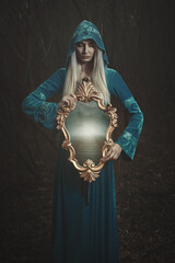 Fantasy woman with magical mirror - 644386434