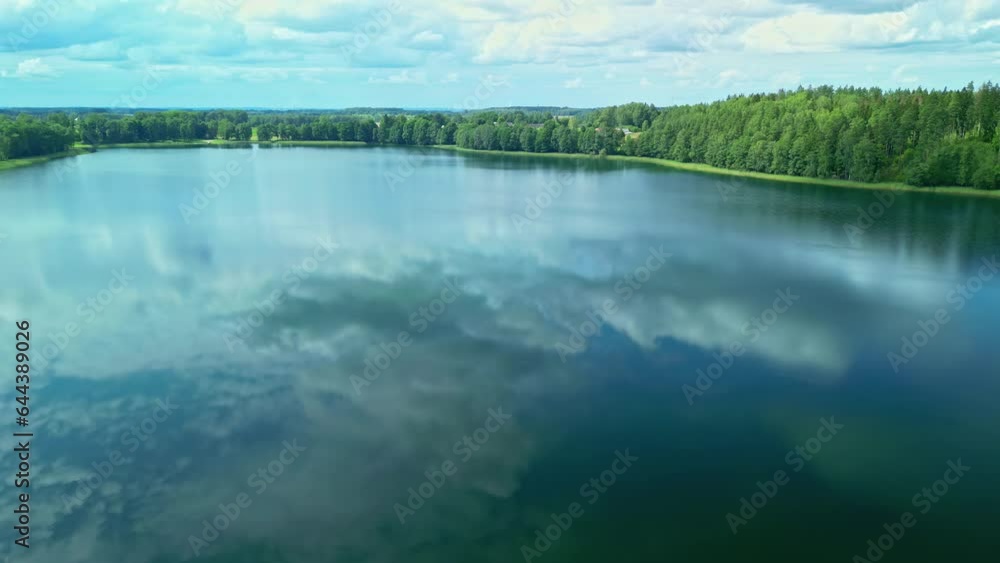 Poster drone view of the reflection of white clouds in the water of a large lake.