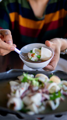Close up women eating seafood