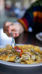 Close up women eating seafood