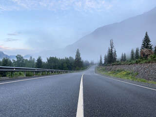 Road in the mountains with morning fog, Mountain Altai.